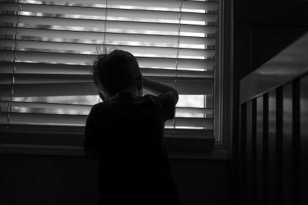 child looking outside the window 